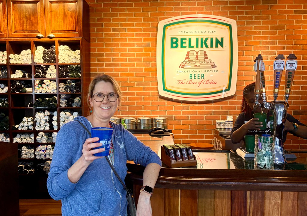 woman drinking beer at bar